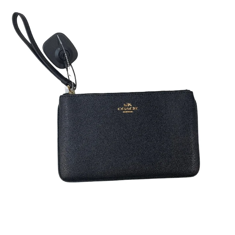 Coach Borough bags with a structured silhouette and a magnetic - snap closureWristlet Designer By Coach, Size: Medium