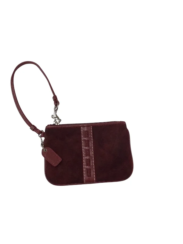 Ladies Coach Tabby bags with a textured leather surface for a more tactile lookWristlet Designer By Coach, Size: Small