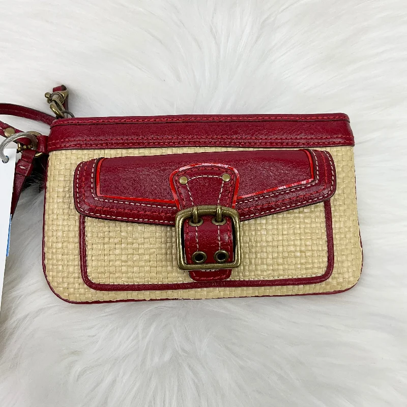 Coach Dempsey bags with a contrast - colored interior for visual interestWristlet Designer By Coach, Size: Medium