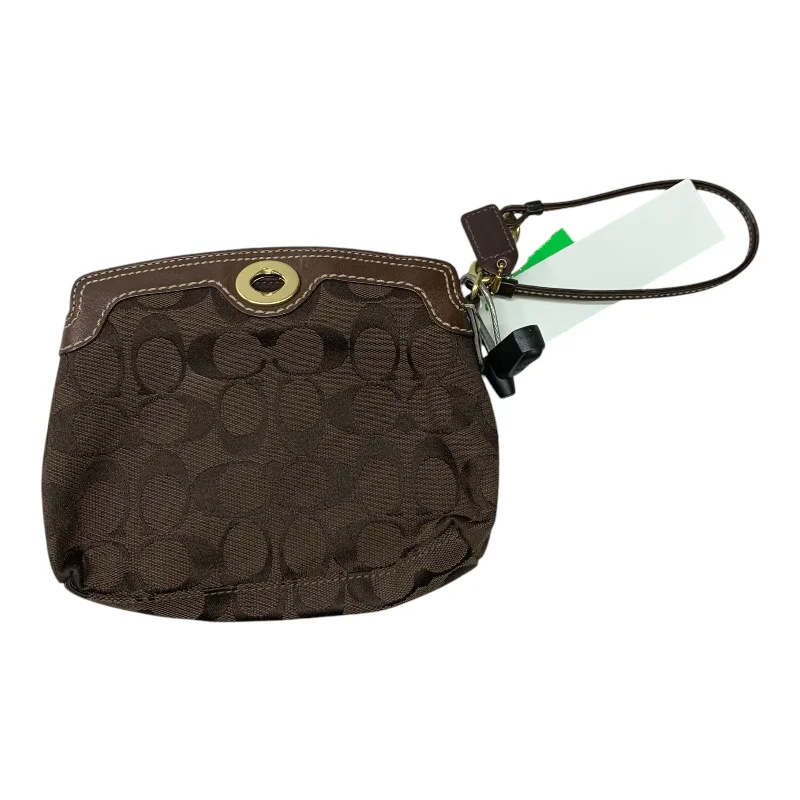 Coach Rogue bags with a detachable shoulder strap for versatile carryingWristlet Designer By Coach, Size: Large