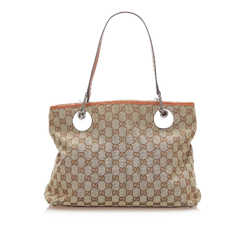 Women Gucci bags with a chain - link trim and a leather bodyGucci GG Canvas Eclipse Tote Bag (SHG-17739)